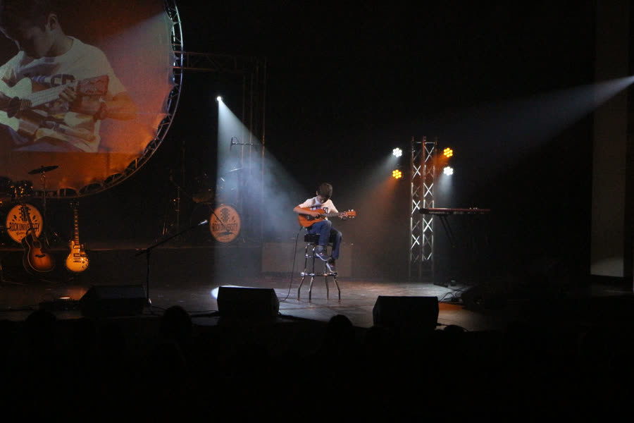 Rock U student performing ukulele on stage at Rock U Live